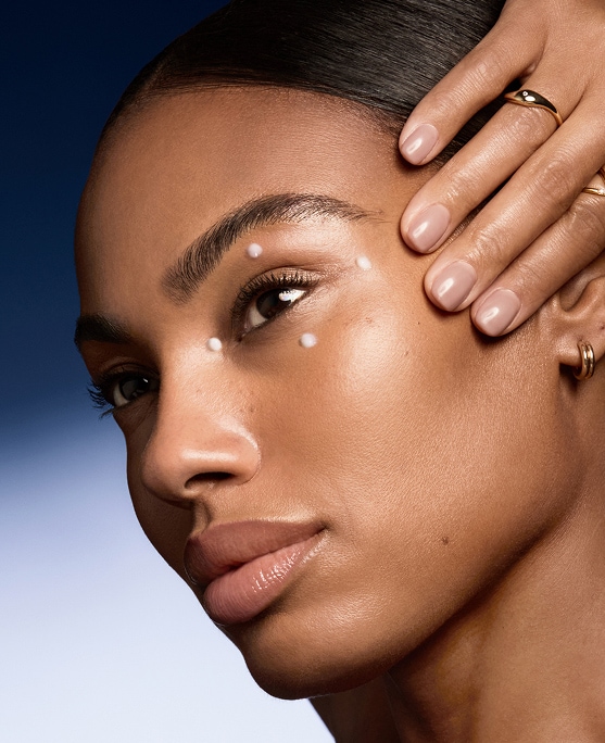 photo of model using eye cream to care for dynamic vs static lines