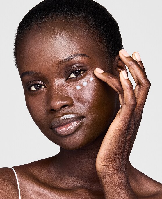 photo of woman applying eye cream to get rid of undereye wrinkles and lines