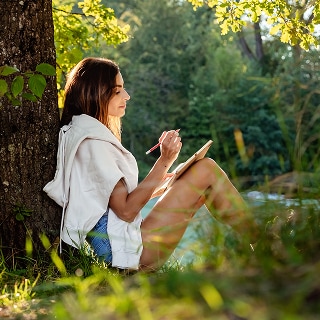 photo of woman journaling